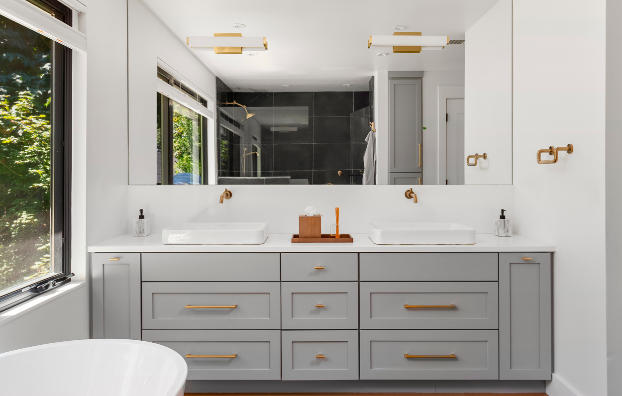 bathroom cabinet with large mirror.