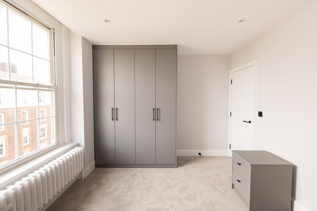 Bedroom with wardrobe and side table