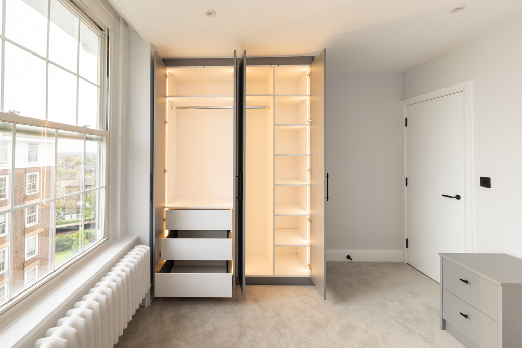 open wardrobe revealing the inner contents.