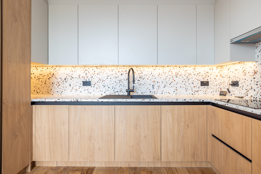 kitchen counter with wooden cabinets.